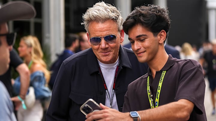Aditya Govila takes a photo with Gordon Ramsay in the paddock at the Formula 1 Pirelli United States Grand Prix at Circuit of the Americas on Saturday, Oct. 19, 2024.