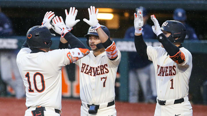 Oregon State's Bryce Hubbard (10) celebrates with his teammates AJ Singer, left, and Cooper Vance during an NCAA college baseball game at Goss Stadium on Friday, March 6, 2026, in Corvallis, Ore.