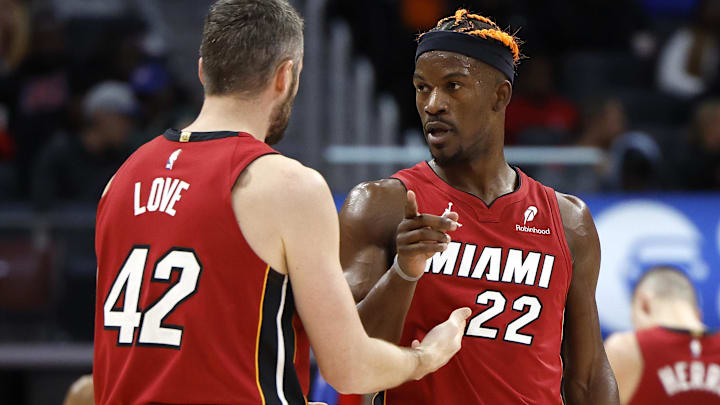 Dec 16, 2024; Detroit, Michigan, USA; Miami Heat forward Kevin Love (42) talks to forward Jimmy Butler (22) in the second half against the Detroit Pistons at Little Caesars Arena. Mandatory Credit: Rick Osentoski-Imagn Images