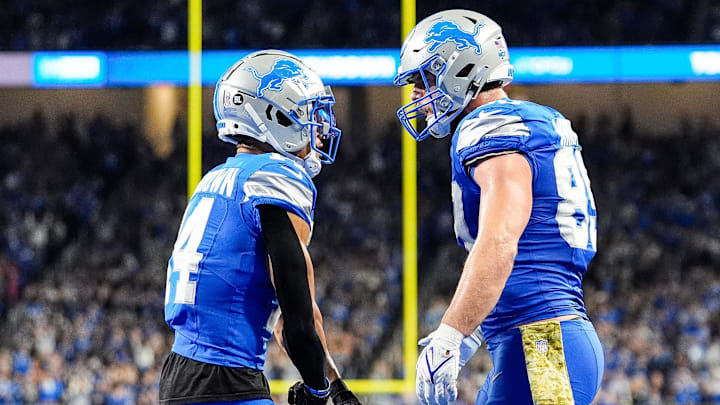 Detroit Lions tight end Brock Wright (89) celebrates a touchdown with wide receiver Amon-Ra St. Brown (14).