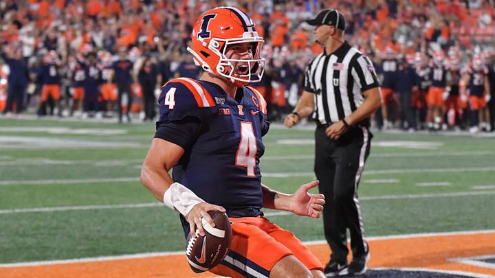 Sep 3, 2026; Champaign, Illinois, USA; Illinois Fighting Illini quarterback Katin Houser (4) scores a touchdown during the second half against the UAB Blazers at Gies Memorial Stadium. Mandatory Credit: Ron Johnson-Imagn Images Sep 3, 2026; Champaign, Illinois, USA; Illinois Fighting Illini quarterback Katin Houser (4) scores a touchdown during the second half against the UAB Blazers at Gies Memorial Stadium. Mandatory Credit: Ron Johnson-Imagn Images