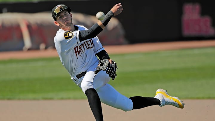 Wisconsin Timber Rattlers' Gregory Barrios (5) throws to first base against the Great Lakes Loons Wednesday, May 1, 2024, at Neuroscience Group Field at Fox Cities Stadium in Grand Chute, Wisconsin. The Great Lakes Loons won 9-8.
