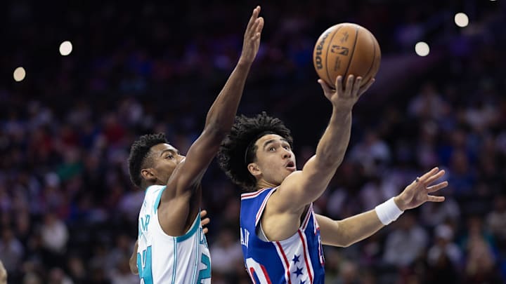Nov 10, 2024; Philadelphia, Pennsylvania, USA; Philadelphia 76ers guard Jared McCain (20) drives for a shot past Charlotte Hornets forward Brandon Miller (24) during the third quarter at Wells Fargo Center. Mandatory Credit: Bill Streicher-Imagn Images
