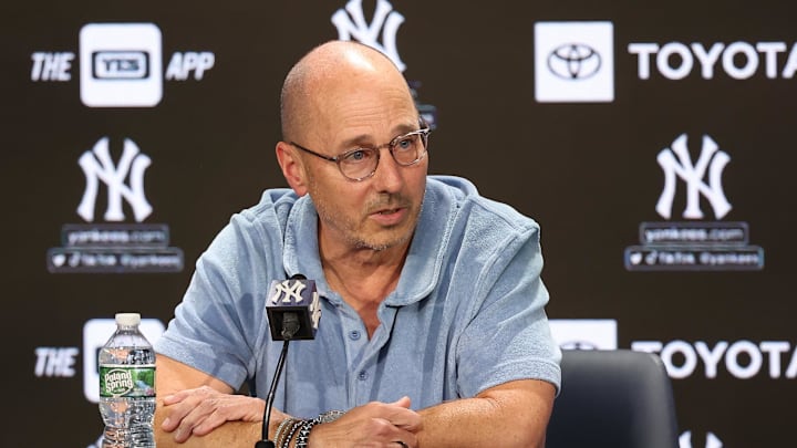 Aug 23, 2023; Bronx, New York, USA; New York Yankees general manager Brian Cashman talks with the