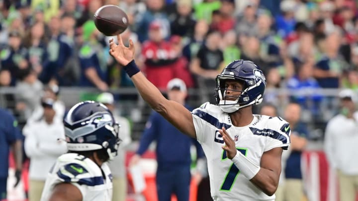 Jan 7, 2024; Glendale, Arizona, USA; Seattle Seahawks quarterback Geno Smith (7) throws in the first half against the Arizona Cardinals at State Farm Stadium.