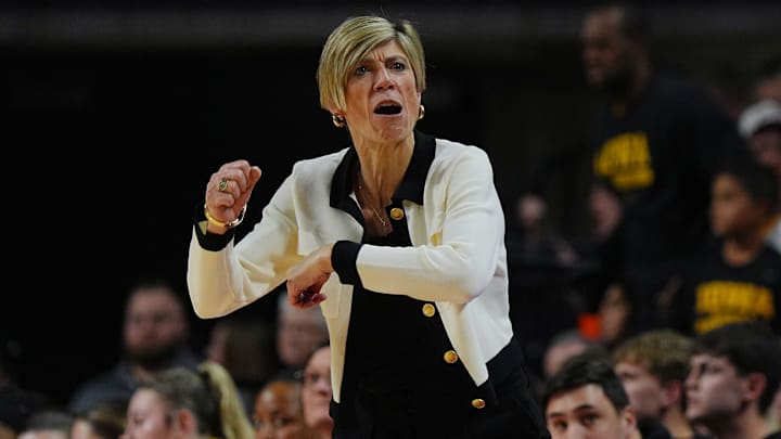 Iowa Hawkeyes women' basketball head coach Jan Jensen reacts during the first quarter against Iowa State in the NCAA women’s basketball Cy-Hawk Series on Dec. 10, 2025, at Hilton Coliseum in Ames, Iowa.