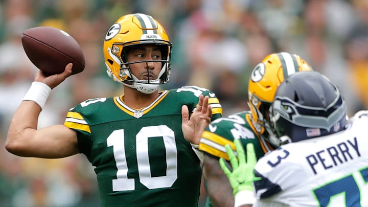Green Bay Packers quarterback Jordan Love (10) scrammbles against the Seattle Seahawks during their