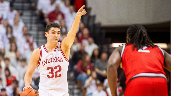 Indiana's Trey Galloway (32) direcrts the offense during the Indiana versus Ohio State men's basketball game at Simon Skjodt Assembly Hall on Saturday, March 8, 2025.