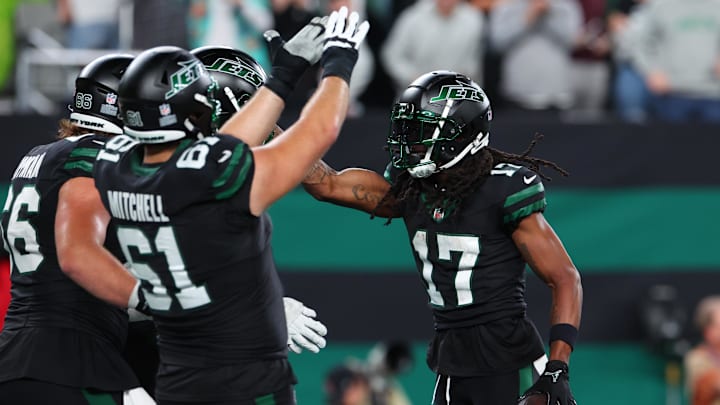 Oct 31, 2024; East Rutherford, New Jersey, USA; New York Jets wide receiver Davante Adams (17) celebrates his touchdown against the Houston Texans during the second half at MetLife Stadium. Mandatory Credit: Ed Mulholland-Imagn Images