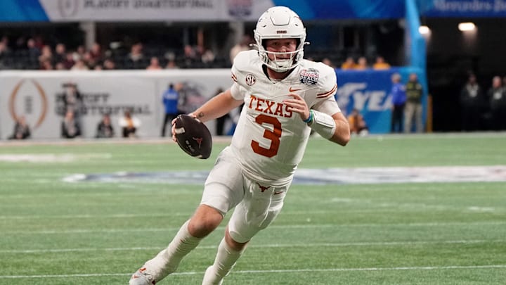 Texas Longhorns quarterback Quinn Ewers runs with the ball for a touchdown against the Arizona State Sun Devils