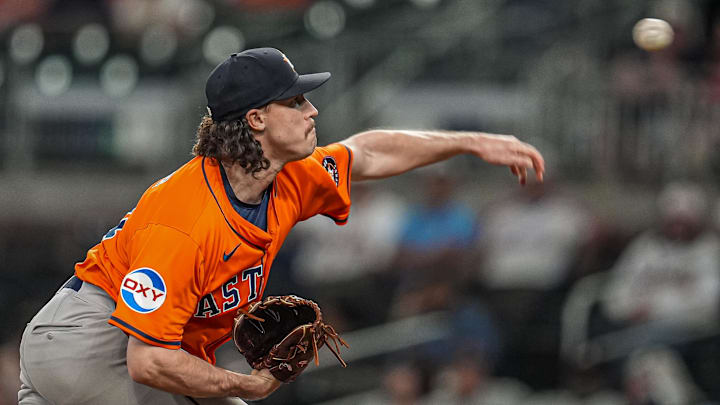 Houston Astros relief pitcher Bryan King (74) pitches against the Atlanta Braves during the ninth inning at Truist Park. Houston Astros relief pitcher Bryan King (74) pitches against the Atlanta Braves during the ninth inning at Truist Park.