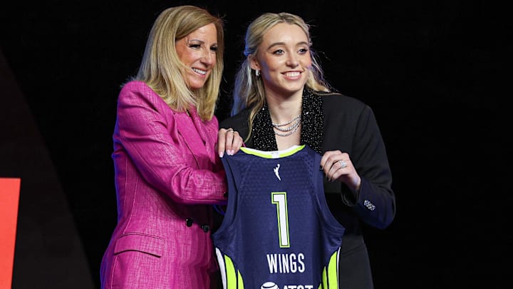 Paige Bueckers poses with WNBA commissioner Cathy Engelbert after being selected with the No. 1 overall pick to the Dallas Wings in the 2025 WNBA Draft.