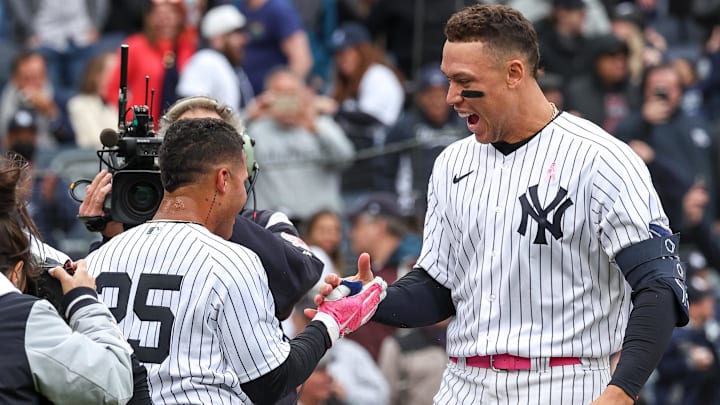 New York Yankees outfielder Aaron Judge celebrates with teammate Gleyber Torres. Judge is tied for first in baseball with nine home runs.