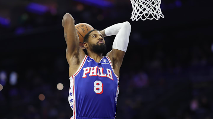 Jan 22, 2026; Philadelphia, Pennsylvania, USA; Philadelphia 76ers forward Paul George (8) dunks the ball against the Houston Rockets during the first quarter at Xfinity Mobile Arena. Mandatory Credit: Bill Streicher-Imagn Images