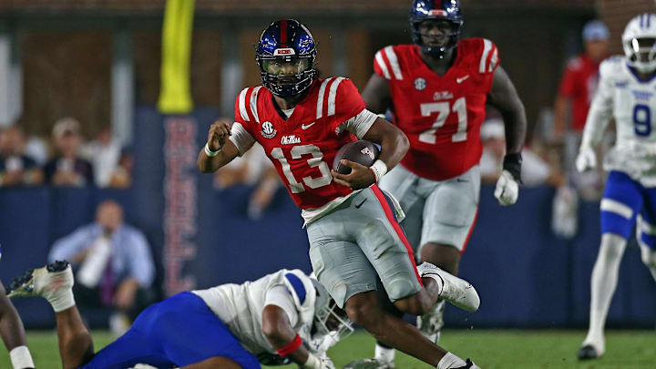 Aug 30, 2025; Oxford, Mississippi, USA; Mississippi Rebels quarterback Austin Simmons (13) runs the ball during the second quarter against the Georgia State Panthers at Vaught-Hemingway Stadium. Mandatory Credit: Petre Thomas-Imagn Images