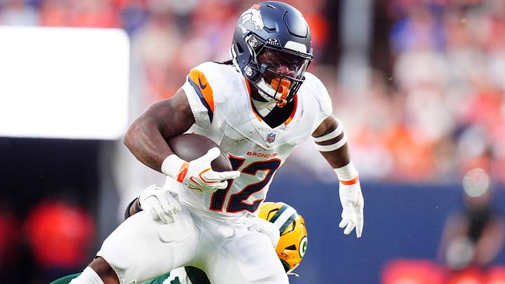 Aug 21, 2026; Denver, Colorado, USA; Denver Broncos running back RJ Harvey (12) runs past the tackle of Green Bay Packers linebacker Edgerrin Cooper (56) in the first quarter of a preseason game at Empower Field at Mile High. Mandatory Credit: Ron Chenoy-Imagn Images Aug 21, 2026; Denver, Colorado, USA; Denver Broncos running back RJ Harvey (12) runs past the tackle of Green Bay Packers linebacker Edgerrin Cooper (56) in the first quarter of a preseason game at Empower Field at Mile High. Mandatory Credit: Ron Chenoy-Imagn Images