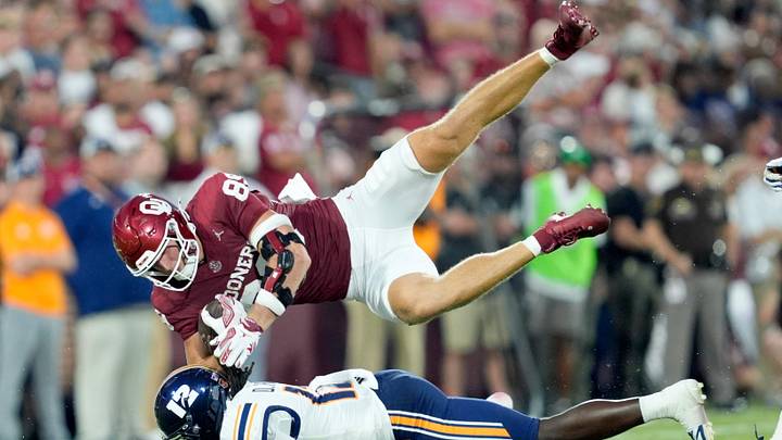 Oklahoma's Rocky Beers (81) is upended by UTEP's Donavan Howard. Oklahoma's Rocky Beers (81) is upended by UTEP's Donavan Howard.