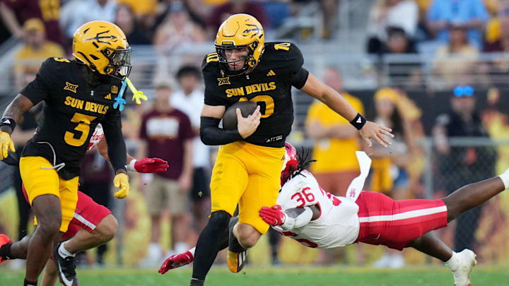 ASU Sun Devils quarterback Sam Leavitt (10) scrambles out of the backfield against the Houston Cougars at Mountain America Stadium in Tempe.
