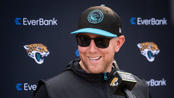 Jacksonville Jaguars head coach Liam Coen has a laugh while answering questions during a press conference after the seventh organized team activity at the Miller Electric Center in Jacksonville, Fla. Monday, June 2, 2025. [Doug Engle/Florida Times-Union]