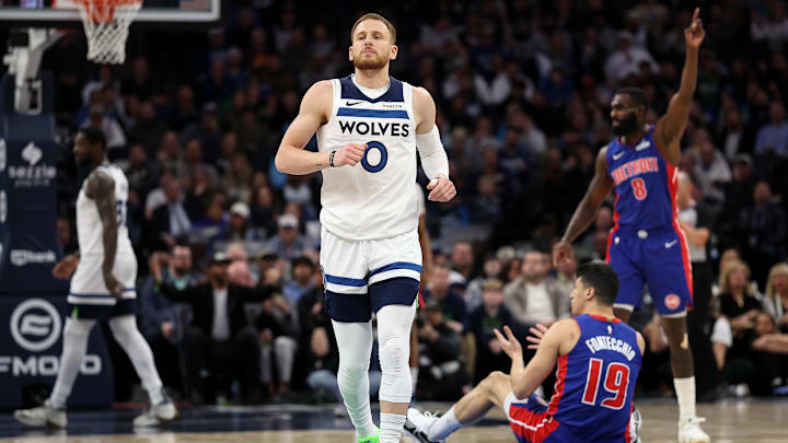 Mar 30, 2025; Minneapolis, Minnesota, USA; Minnesota Timberwolves guard Donte DiVincenzo (0) looks on during the first quarter against the Detroit Pistons at Target Center. Mandatory Credit: Matt Krohn-Imagn Images
