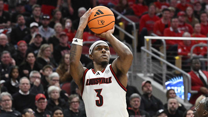 Jan 6, 2026; Louisville, Kentucky, USA;  Louisville Cardinals guard Ryan Conwell (3) shoots against Duke Blue Devils guard Dame Sarr (7) during the second half at KFC Yum! Center. Duke defeated Louisville 84-73. Mandatory Credit: Jamie Rhodes-Imagn Images