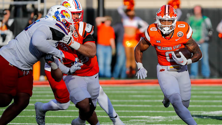 Oct 14, 2023; Stillwater, Oklahoma, USA; Oklahoma State's Ollie Gordon II (0) runs the ball against the Kansas Jayhawks in the fourth quarter at Boone Pickens Stadium. Mandatory Credit: Nathan J. Fish-Imagn Images Oct 14, 2023; Stillwater, Oklahoma, USA; Oklahoma State's Ollie Gordon II (0) runs the ball against the Kansas Jayhawks in the fourth quarter at Boone Pickens Stadium. Mandatory Credit: Nathan J. Fish-Imagn Images