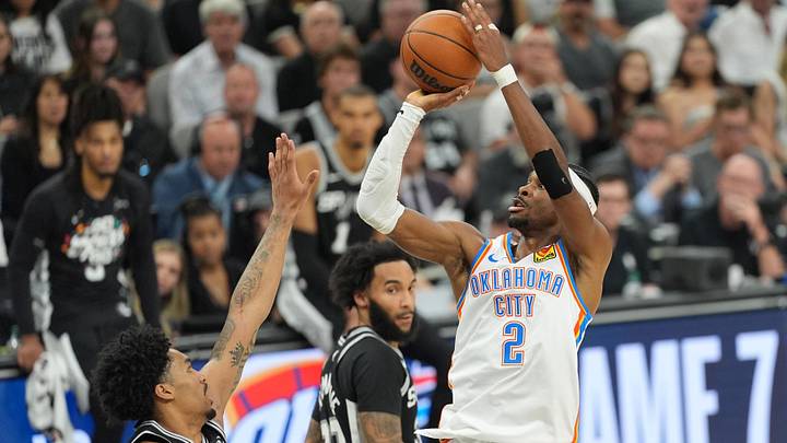May 28, 2026; San Antonio, Texas, USA; Oklahoma City Thunder guard Shai Gilgeous-Alexander (2) shoots the ball past San Antonio Spurs guard Dylan Harper (2) in the first half during game six of the western conference finals for the 2026 NBA playoffs at Frost Bank Center. Mandatory Credit: Daniel Dunn-Imagn Images May 28, 2026; San Antonio, Texas, USA; Oklahoma City Thunder guard Shai Gilgeous-Alexander (2) shoots the ball past San Antonio Spurs guard Dylan Harper (2) in the first half during game six of the western conference finals for the 2026 NBA playoffs at Frost Bank Center. Mandatory Credit: Daniel Dunn-Imagn Images