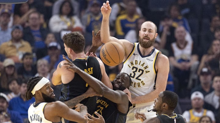 Nov 9, 2025; San Francisco, California, USA; Indiana Pacers forward Isaiah Jackson (22) and center Jay Huff (32) battle Golden State Warriors center Quinten Post (21), and forwards Draymond Green (23) and Jonathan Kuminga (1) for a loose ball during the first quarter at Chase Center. Mandatory Credit: D. Ross Cameron-Imagn Images