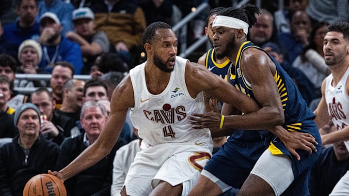 Jan 14, 2025; Indianapolis, Indiana, USA;  Cleveland Cavaliers forward Evan Mobley (4) dribbles the ball while Indiana Pacers forward Jarace Walker (5) defends in the second half at Gainbridge Fieldhouse. Mandatory Credit: Trevor Ruszkowski-Imagn Images