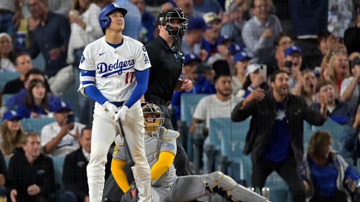 Oct 18, 2025; Los Angeles, California, USA; Los Angeles Dodgers two-way player Shohei Ohtani (17) watches the flight of the ball after hitting his third solo home run of the game Oct 18, 2025; Los Angeles, California, USA; Los Angeles Dodgers two-way player Shohei Ohtani (17) watches the flight of the ball after hitting his third solo home run of the game