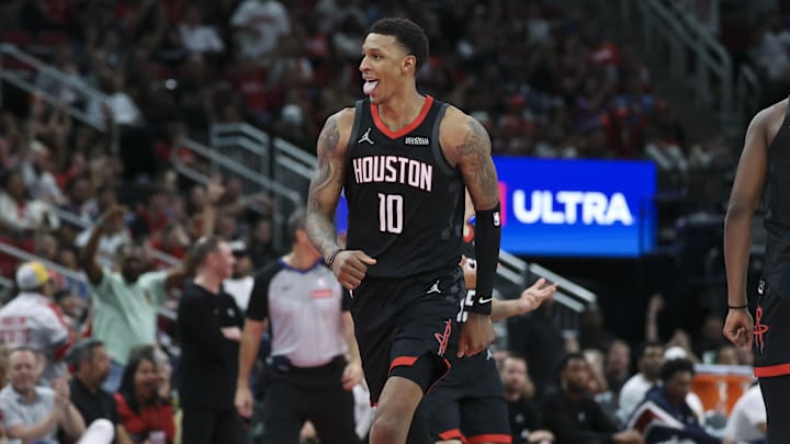 Nov 21, 2025; Houston, Texas, USA; Houston Rockets forward Jabari Smith Jr. (10) reacts after making a basket during the fourth quarter against the Denver Nuggets at Toyota Center. Mandatory Credit: Troy Taormina-Imagn Images