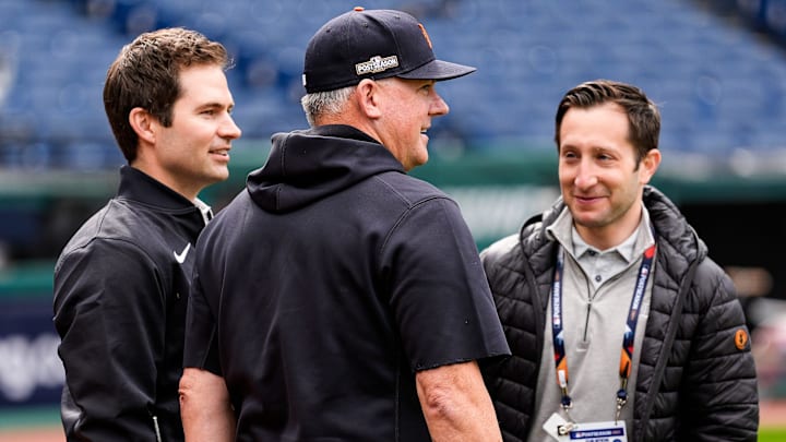 From left, Detroit Tigers president of baseball operations Scott Harris, talks to manager A.J. Hinch and general manager Jeff Greenberg before Game 2 of ALDS at Progressive Field in Cleveland, Ohio on Monday, Oct. 7, 2024.