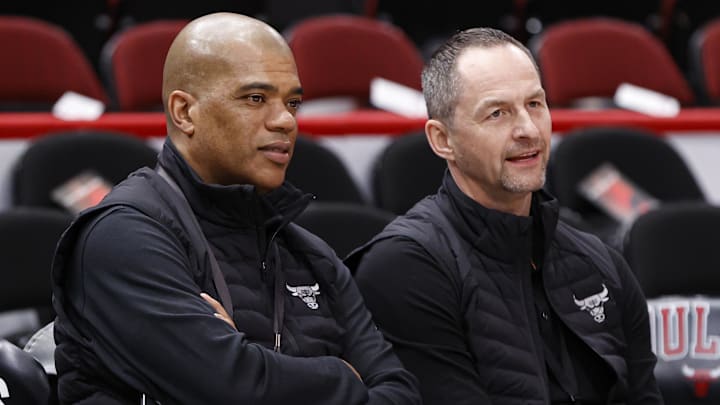Apr 22, 2022; Chicago, Illinois, USA; Chicago Bulls executive vice president of basketball operations Arturas Karnisovas (right) talks with general manager Marc Eversley (left) before game three of the first round for the 2022 NBA playoffs against the Milwaukee Bucks at United Center. Mandatory Credit: Kamil Krzaczynski-Imagn Images