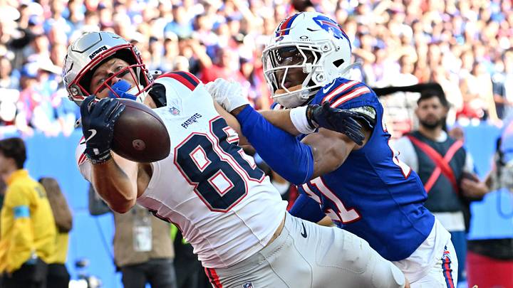 Oct 4, 2026; Orchard Park, New York, USA;  New England Patriots wide receiver Efton Chism III (86) makes a catch for a touchdown as Buffalo Bills cornerback Davison Igbinosun (21) defends during the fourth quarter at New Highmark Stadium.  Mandatory Credit: Mark Konezny-Imagn Images