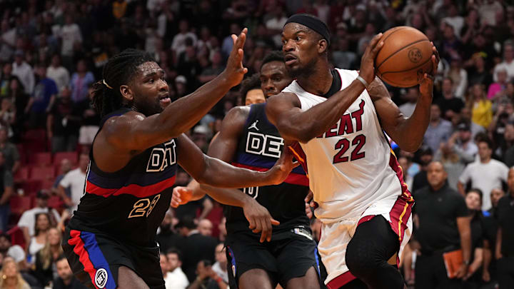 Oct 25, 2023; Miami, Florida, USA; Miami Heat forward Jimmy Butler (22) passes the ball away from Detroit Pistons center Isaiah Stewart (28) during the first second half at Kaseya Center. Mandatory Credit: Jasen Vinlove-Imagn Images