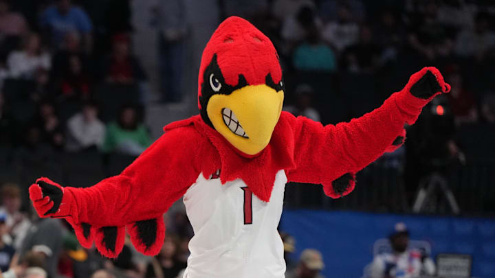 Mar 11, 2026; Charlotte, NC, USA; Louisville Cardinals mascot performs in the first half at Spectrum Center. Mandatory Credit: Bob Donnan-Imagn Images Mar 11, 2026; Charlotte, NC, USA; Louisville Cardinals mascot performs in the first half at Spectrum Center. Mandatory Credit: Bob Donnan-Imagn Images
