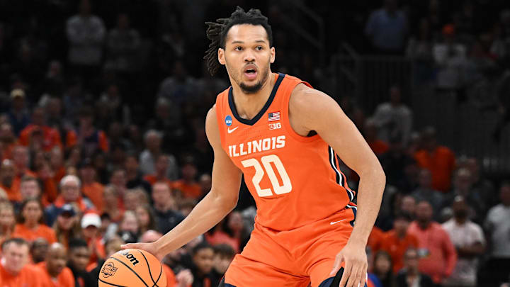Mar 30, 2024; Boston, MA, USA; Illinois Fighting Illini forward Ty Rodgers (20) dribbles the ball against the Connecticut Huskies in the finals of the East Regional of the 2024 NCAA Tournament at TD Garden. Mandatory Credit: Brian Fluharty-Imagn Images