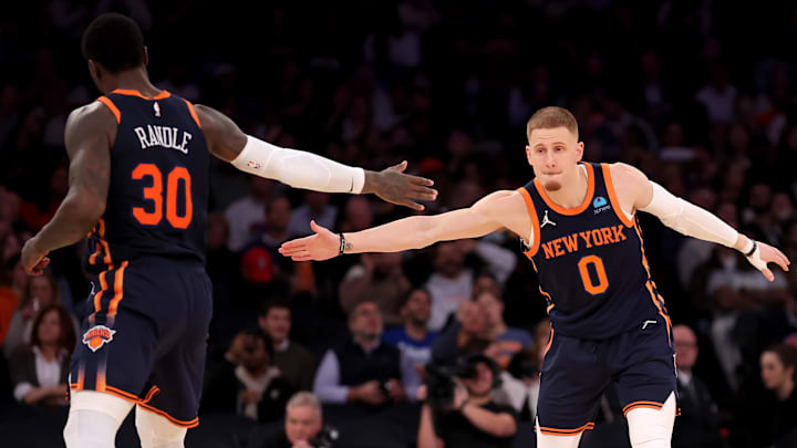 New York Knicks guard Donte DiVincenzo (0) high fives forward Julius Randle (30) during the third quarter against the Denver Nuggets at Madison Square Garden in New York on Jan. 25, 2024. 