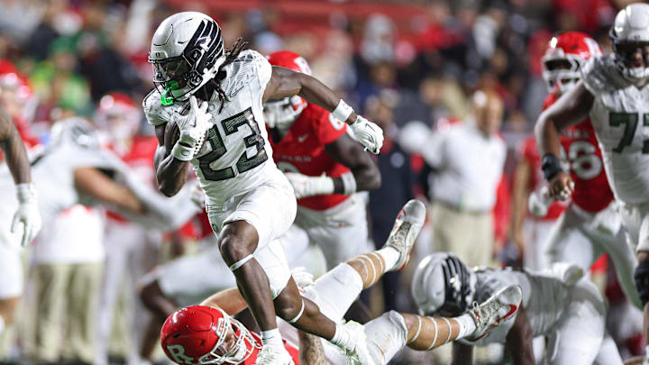 Oct 18, 2025; Piscataway, New Jersey, USA;  Oregon Ducks running back Dierre Hill Jr. (23) carries the ball against the Rutgers Scarlet Knights during the second half at SHI Stadium. Mandatory Credit: Vincent Carchietta-Imagn Images