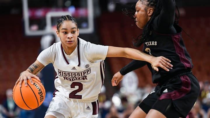 Mississippi State guard Jerkaila Jordan (2) moves the ball past Texas A & M guard Tineya Hylton (3) during the third quarter of the SEC Women's Basketball Tournament game three at the Bon Secours Wellness Arena in Greenville, S.C. Thursday, March 7, 2024.