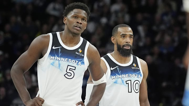 Minnesota Timberwolves guards Anthony Edwards (5) and Mike Conley watch as a member of the Atlanta Hawks shoots free throws in the fourth quarter at Target Center in Minneapolis on Jan. 27, 2025.