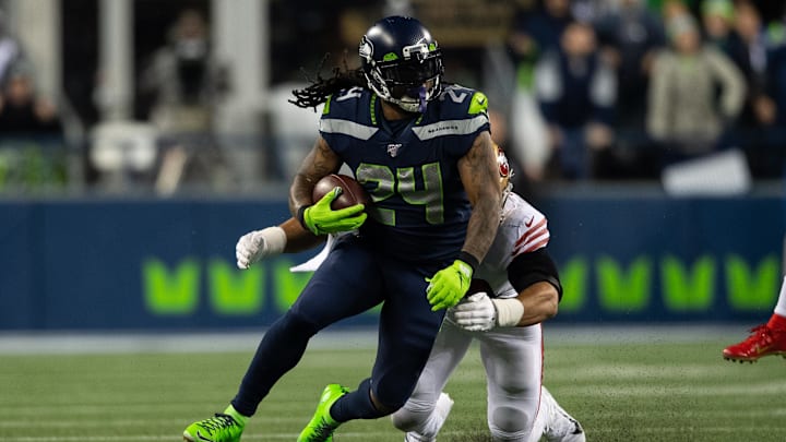 Dec 29, 2019; Seattle, Washington, USA; Seattle Seahawks running back Marshawn Lynch (24) carries the ball against the San Francisco 49ers during the second half at CenturyLink Field. San Francisco defeated Seattle 26-21. Mandatory Credit: Steven Bisig-Imagn Images Dec 29, 2019; Seattle, Washington, USA; Seattle Seahawks running back Marshawn Lynch (24) carries the ball against the San Francisco 49ers during the second half at CenturyLink Field. San Francisco defeated Seattle 26-21. Mandatory Credit: Steven Bisig-Imagn Images