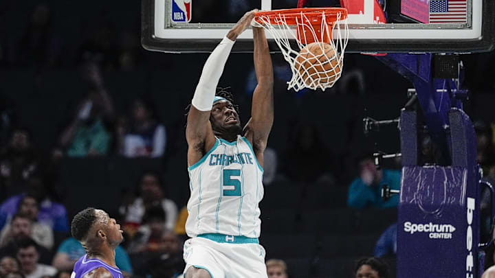 Mar 31, 2025; Charlotte, North Carolina, USA; Charlotte Hornets center Mark Williams (5) gets a dunk over Utah Jazz center Oscar Tshiebwe (34) during the second half at Spectrum Center. Mandatory Credit: Jim Dedmon-Imagn Images