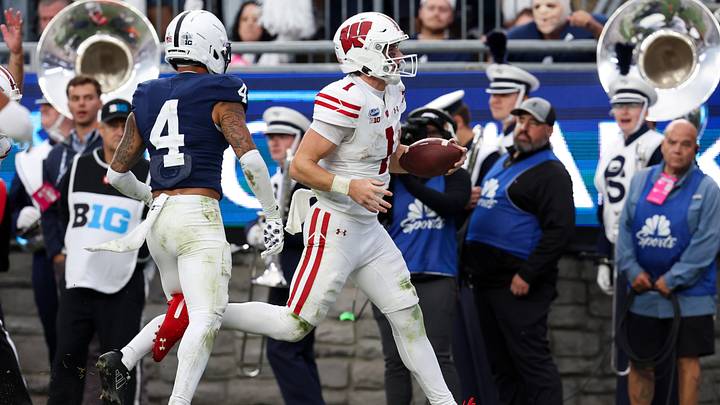 Sep 26, 2026; University Park, Pennsylvania, USA;  Wisconsin Badgers quarterback Colton Joseph (1) runs the ball into the end zone for a touchdown during the second quarter against the Penn State Nittany Lions at West Shore Home Field at Beaver Stadium.  Mandatory Credit: Matthew O'Haren-Imagn Images