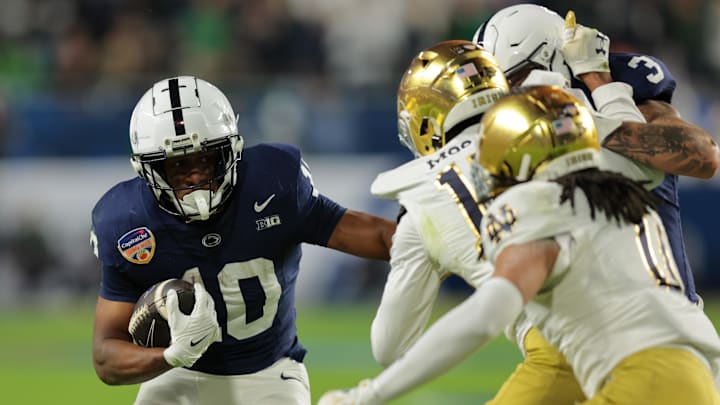 Nicholas Singleton carries against Notre Dame in the Orange Bowl last season.