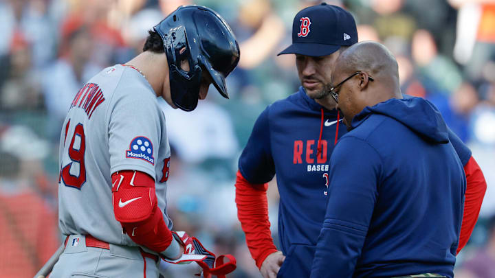 May 4, 2026; Detroit, Michigan, USA;  Boston Red Sox left fielder Roman Anthony (19) is checked on by interim manager Chad Tracy (17) and the trainer in the first inning against the Detroit Tigers at Comerica Park. Mandatory Credit: Rick Osentoski-Imagn Images