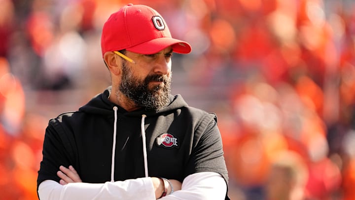Ohio State Buckeyes defensive coordinator Matt Patricia watches warm ups prior to the NCAA football game against the Illinois Fighting Illini at Gies Memorial Stadium in Champaign on Oct. 11, 2025.