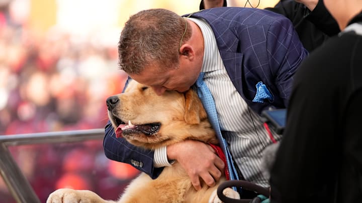 Kirk Herbstreit hugs his dog, Peter, on the set of ESPN College GameDay prior to the NCAA football game between the Ohio State Buckeyes and the Texas Longhorns at Ohio Stadium on Aug. 30, 2025. Kirk Herbstreit hugs his dog, Peter, on the set of ESPN College GameDay prior to the NCAA football game between the Ohio State Buckeyes and the Texas Longhorns at Ohio Stadium on Aug. 30, 2025.