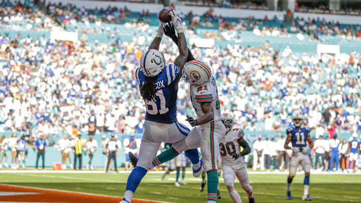 Indianapolis Colts tight end Mo Alie-Cox (81) makes a catch in the end zone for a touchdown as Miami Dolphins free safety Eric Rowe (21) attempt to block the pass during the fourth quarter of the game at Hard Rock Stadium in the teams' last meeting in 2021.