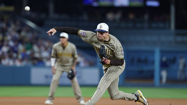 Jul 4, 2026; Los Angeles, California, USA; San Diego Padres pitcher Mason Miller (22) delivers a pitch in the eighth inning against the Los Angeles Dodgers at Dodger Stadium. Mandatory Credit: Kiyoshi Mio-Imagn Images